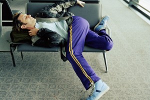 Man-sleeping-in-airport